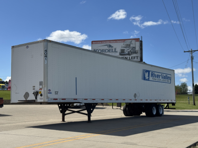 Trailer show of a used 2014 Utility 4000D-X semi-trailer with River Valley Trailer Leasing branding, number 4041, 53' length, parked on road.