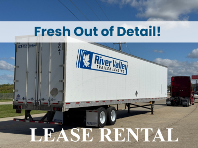 Trailer side showing River Valley Trailer Leasing logo on white box trailer with blue lettering and rear doors.