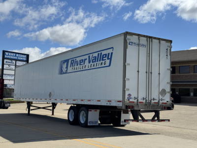 Trailer side showing River Valley Trailer Leasing logo on a 2014 Utility 4000D-X box trailer with tandem axle and rear doors.