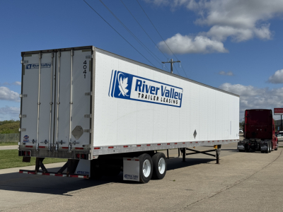 Trailer shown in a parking lot with River Valley Trailer Leasing logo on the side and rear doors open. 2014 Utility 4000D-X trailer.