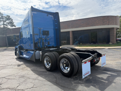 Kenworth T680 tractor rear and cab side showing dual rear axles and sleeper area.