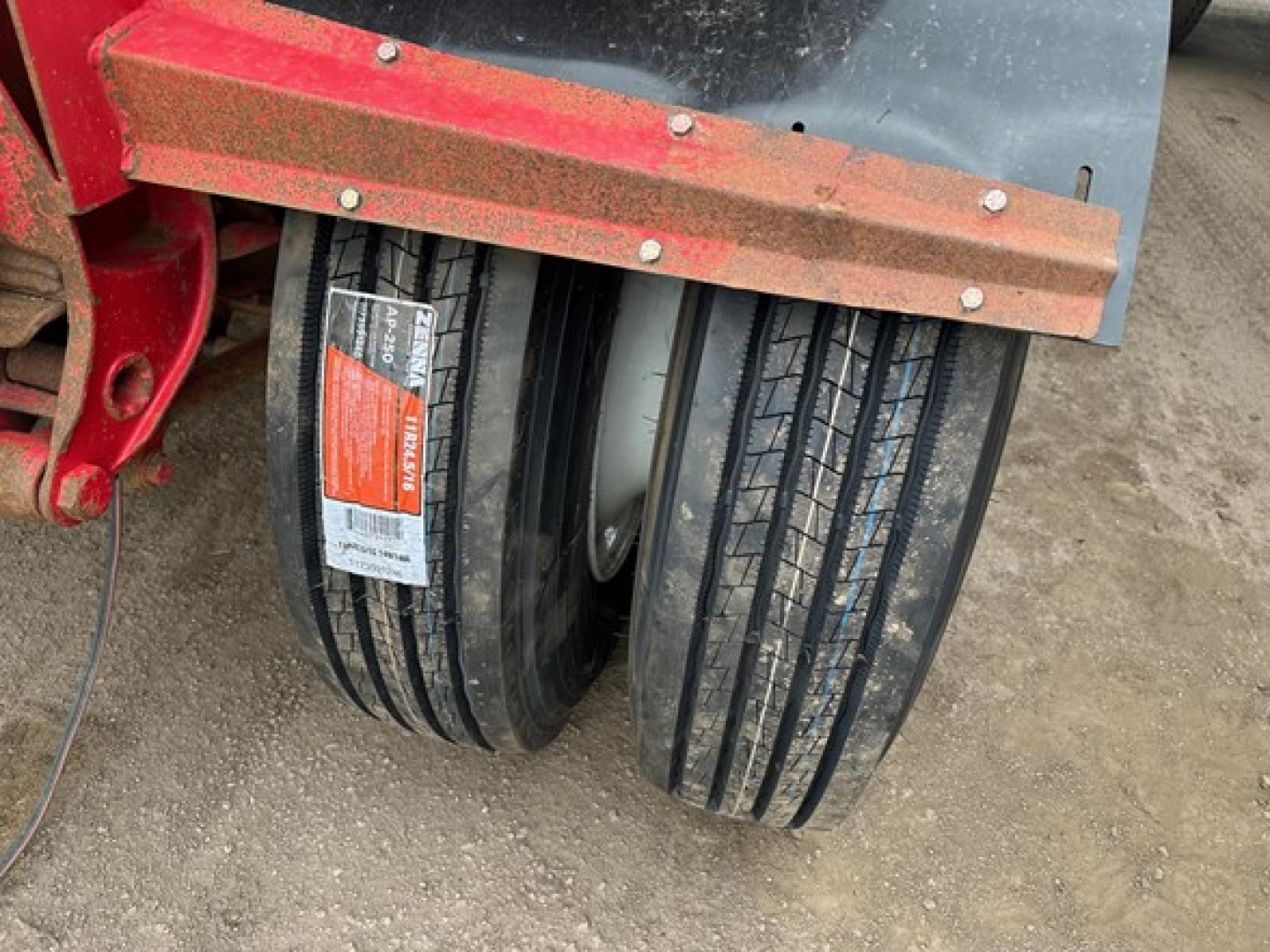 Ranco LW11-20P Pup trailer wheels and axle with dual tires and red metal frame.