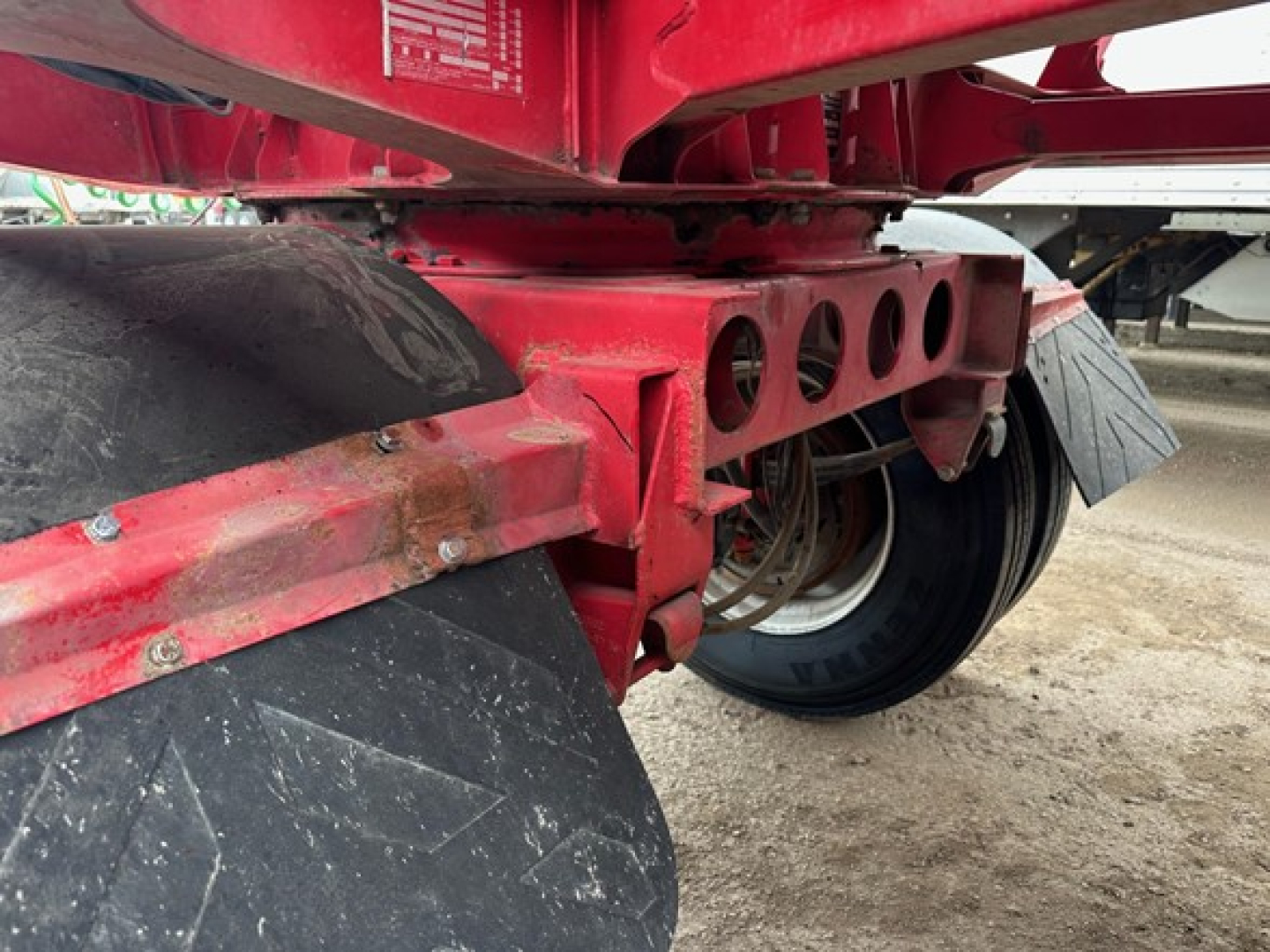 Ranco LW11-20P trailer hitch area showing red frame, circular cutouts, and dual rear axles with black tires.