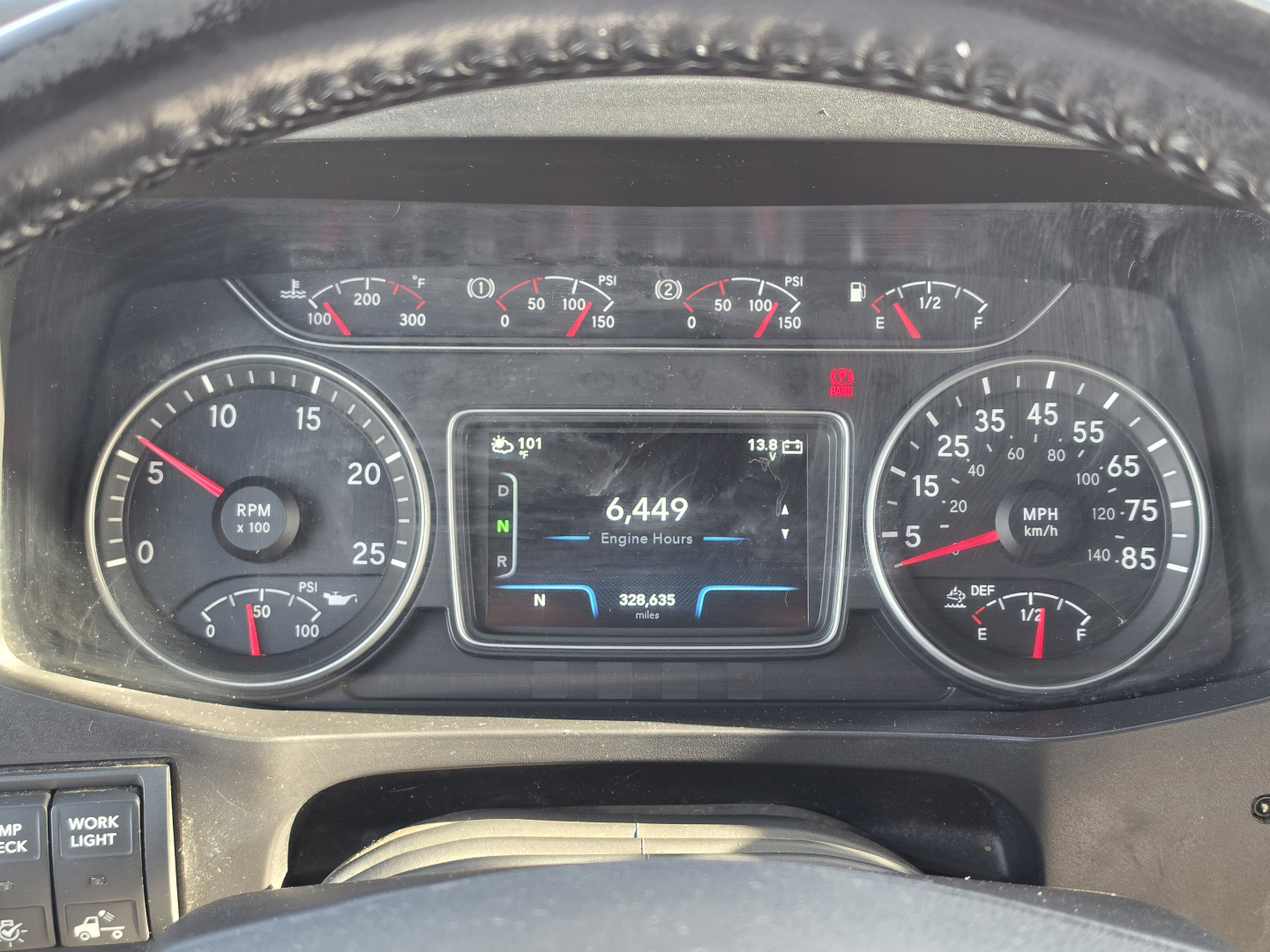 Dashboard of a 2023 International LT625 showing multiple gauges, central display with 6,449 engine hours, and various indicator lights.