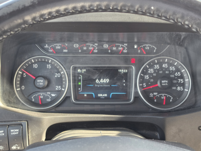 Dashboard of a 2023 International LT625 showing multiple gauges, central display with 6,449 engine hours, and various indicator lights.