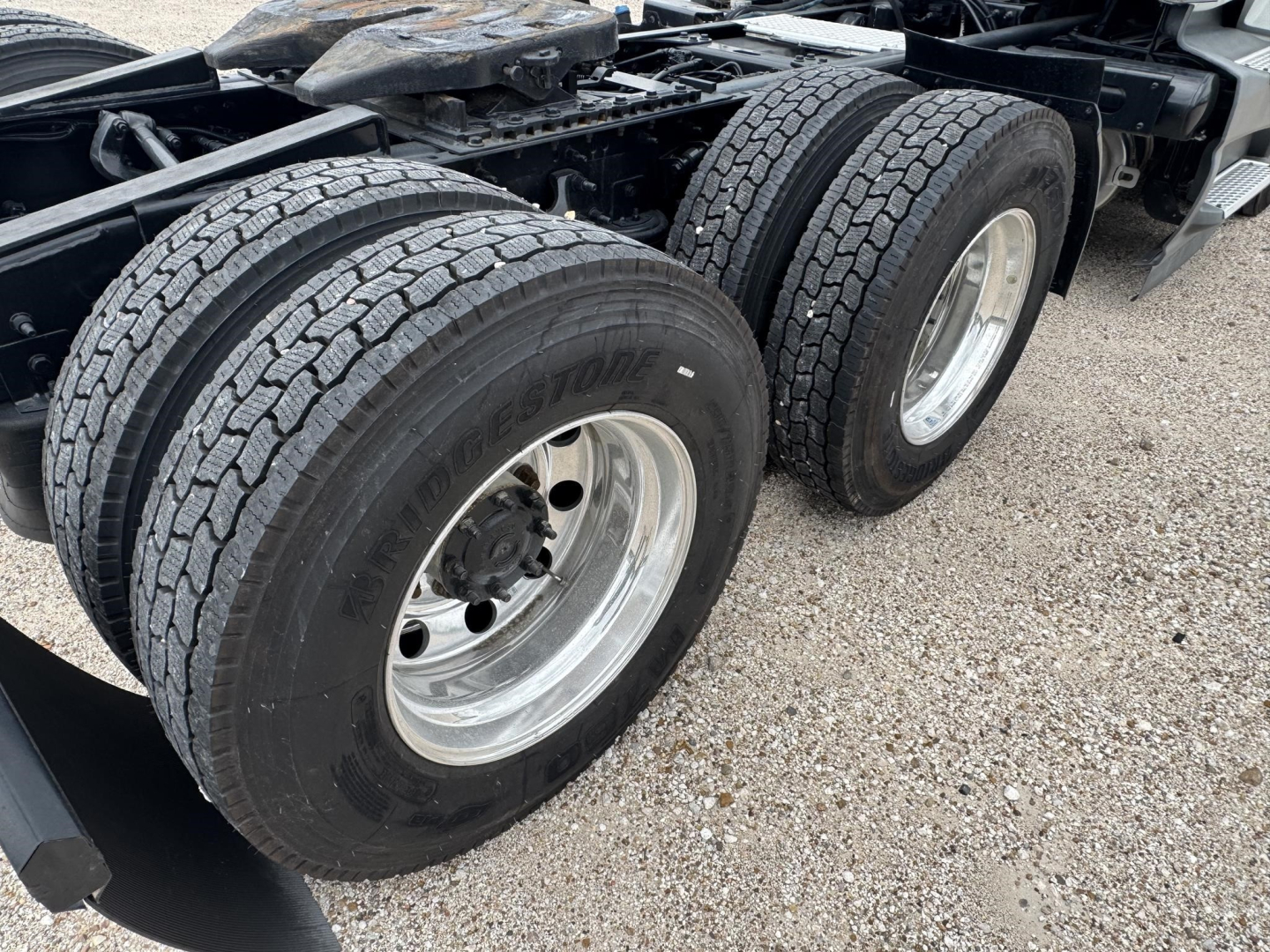 International LT truck rear dual-wheeled axle showing tires and wheels.