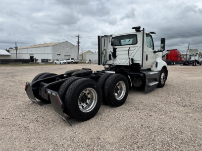 Truck chassis and rear view of a 2021 International LT Daycab showing dual rear axles and hitch area.