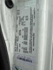 Vehicle data plate on International LT showing GVWR, GAWR, tire size, pressures, VIN, and manufacturer info.