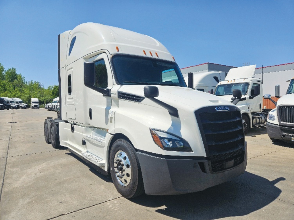 Truck cab front view of a white 2020 Freightliner Cascadia 126 in a dealership lot