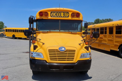 Front view of a yellow 2018 Blue Bird Vision school bus with 'SCHOOL BUS' sign, black bumper, large windshield, and side mirrors.