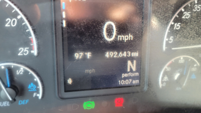 Dashboard of a Freightliner Cascadia126 showing digital gauge cluster with 0 mph, 97°F ambient, 492,643 miles, gear N, and various indicator lights.