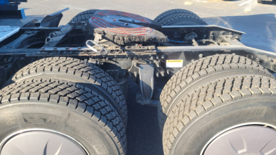 Freightliner Cascadia126 truck chassis showing rear dual-axle configuration with tires and frame; no drivetrain details visible.