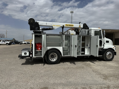 Service/Utility truck with Palfinger crane and multiple tool compartments, side view showing compartments and crane arm
