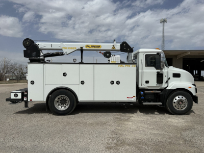 Panel van body showing Palfinger PK crane mounted on service truck with white cab and utility compartments.