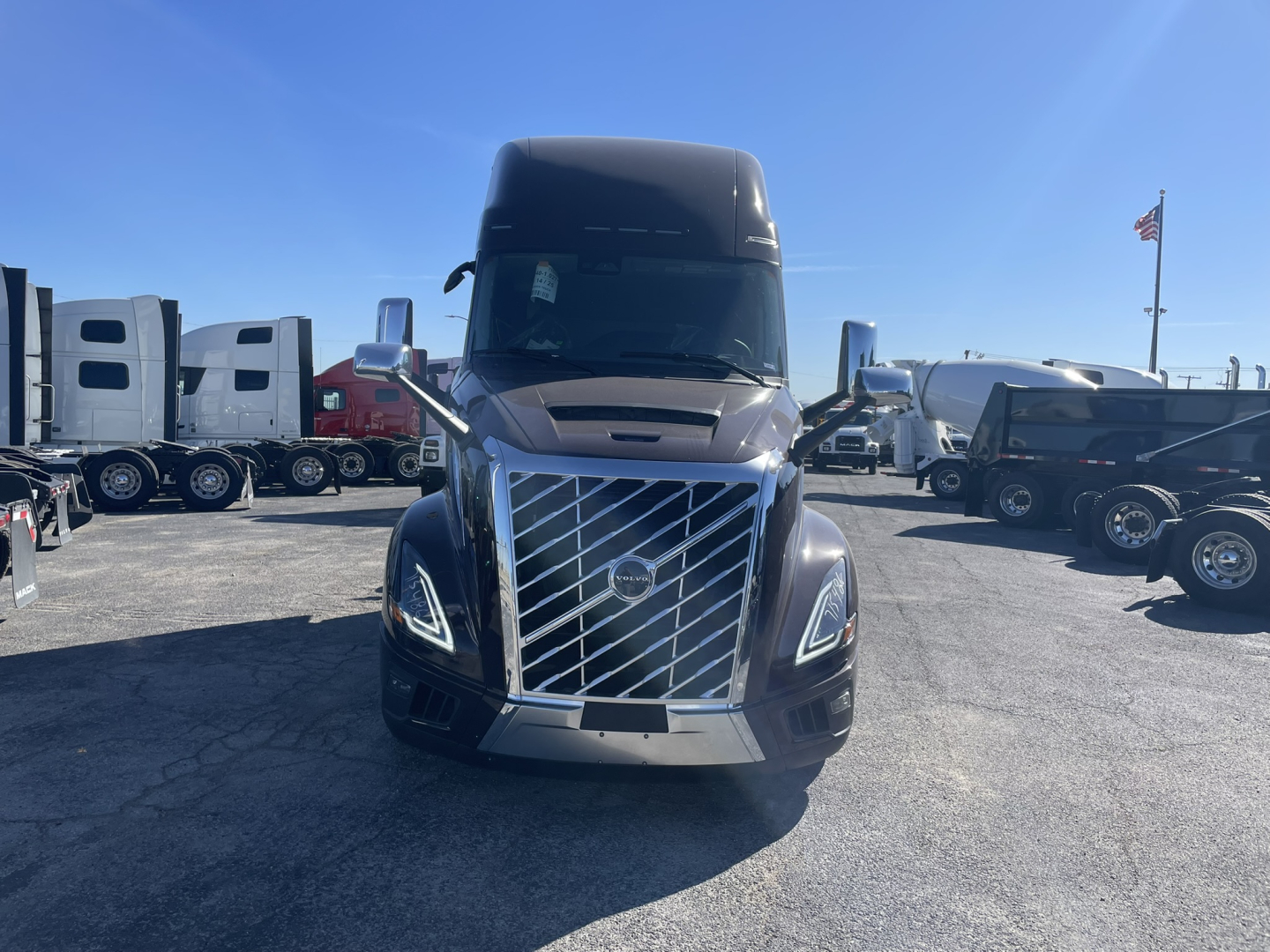 Front view of a 2026 Volvo VNL64T860 conventional sleeper truck showing large chrome grille and headlights.