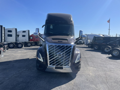 Front view of a 2026 Volvo VNL64T860 conventional sleeper truck showing large chrome grille and headlights.