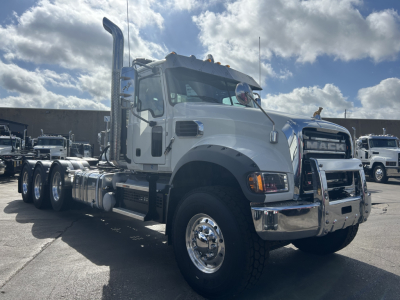 Mack GR84FT conventional daycab truck showing chrome bumper and dual exhaust stack with large front grille and model badge.