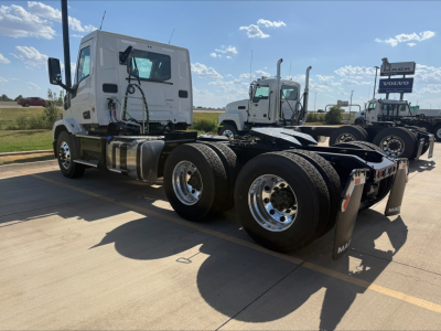 Truck chassis and cab of a 2027 Mack AN64T day cab tractor showing rear fifth-wheel area and dual rear axles with large wheels.
