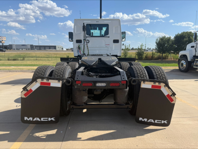 Mack AN64T rear view showing dual rear axles with mud flaps labeled 'MACK' and standard fifth wheel hitch area.