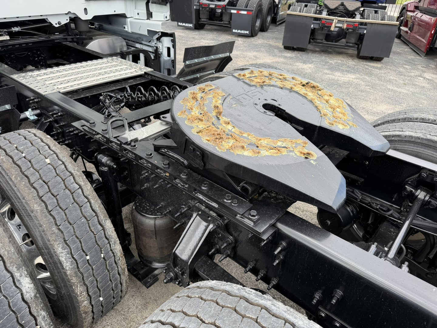 Volvo VNL64T860 chassis and drivetrain showing fifth wheel and dual rear axles.