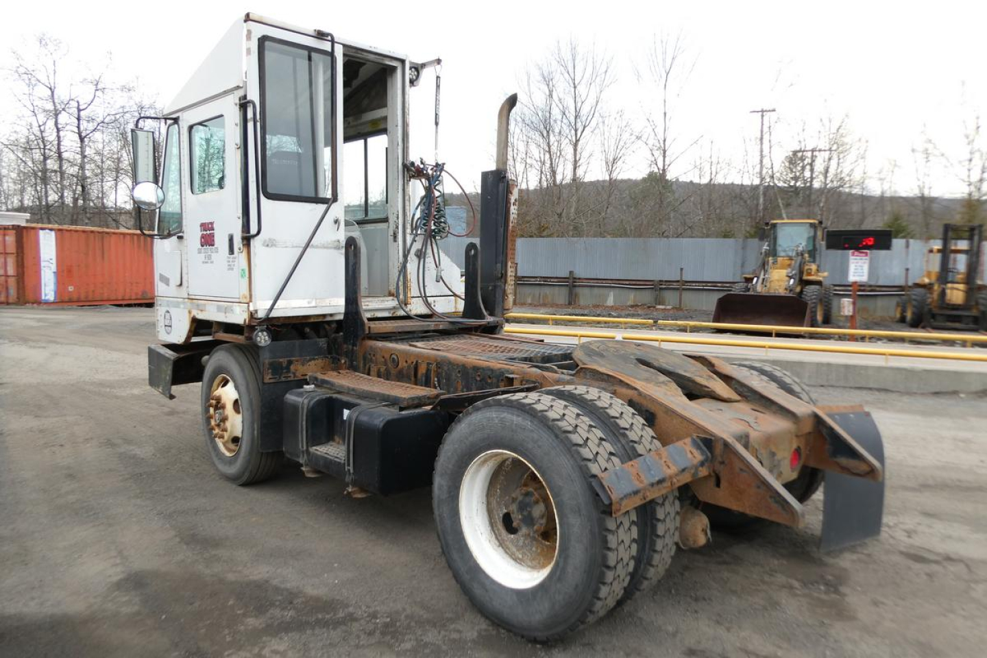 Truck tractor chassis with cab and rear hook-up area; visible text on cab window area and side panel reads Ottawa? and numbers from sticker.