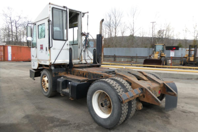 Truck tractor chassis with cab and rear hook-up area; visible text on cab window area and side panel reads Ottawa? and numbers from sticker.
