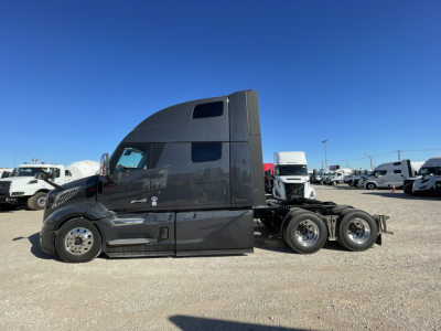 Truck side view of a 2026 Volvo VNL64T860 conventional sleeper showing cab with high roof and dual rear axles.