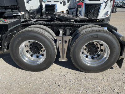 Volvo VNL64T860 tractor dual rear wheels showing clean chrome rims and tire treads.