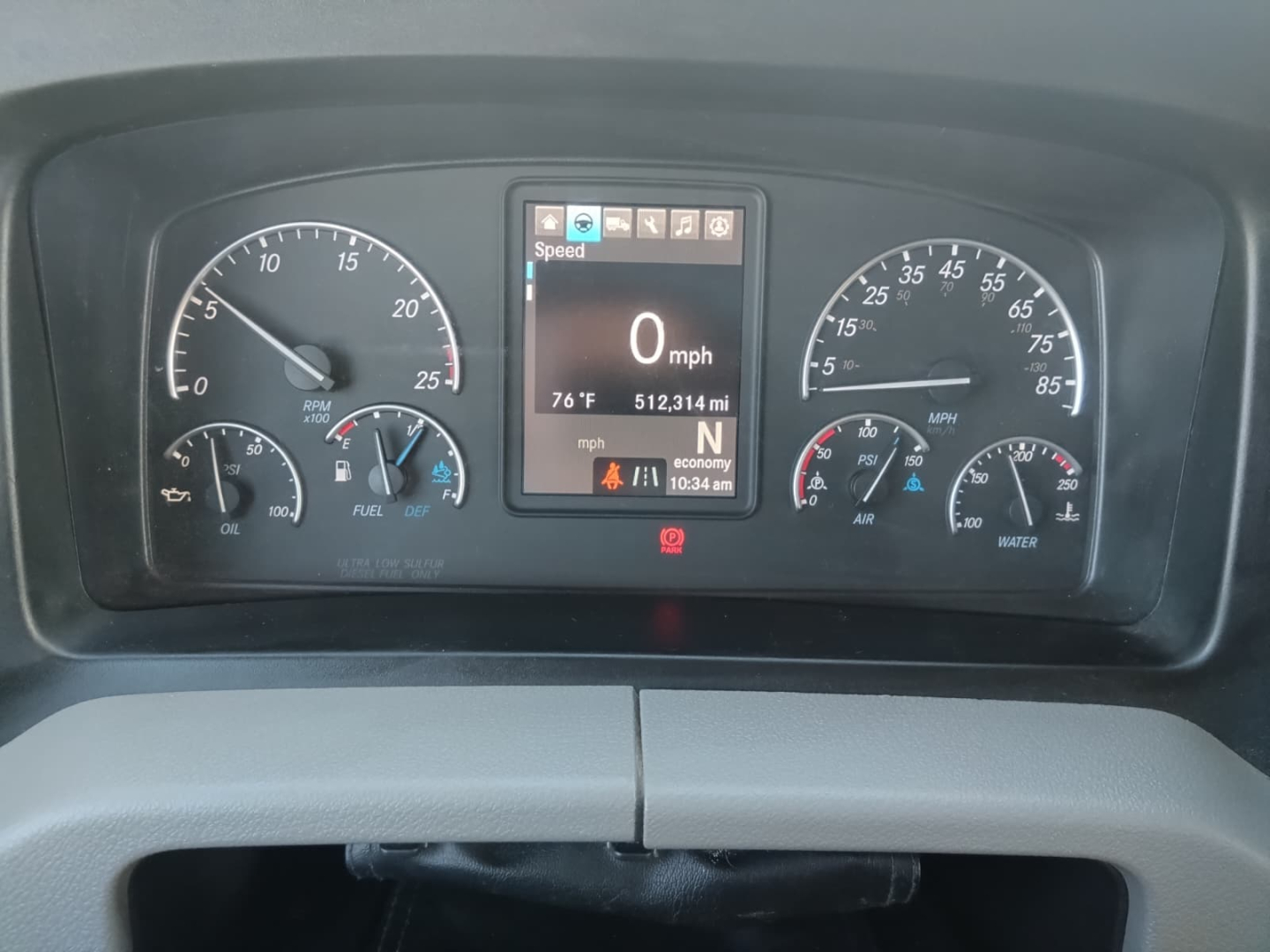 Dashboard view of a 2020 Freightliner Cascadia showing speedometer, tachometer, fuel, and digital display with 0 mph and trip data.