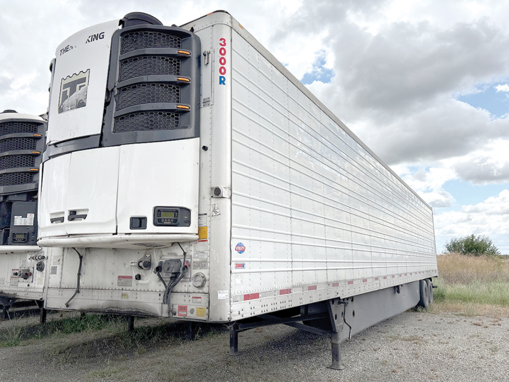 Utility 3000R refrigerated trailer showing Thermo King unit at front with doors and side paneling visible.