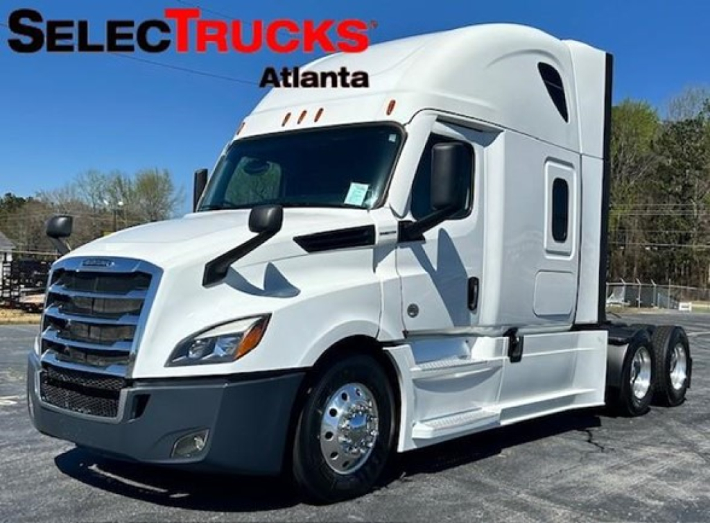Freightliner Cascadia 126 truck side view with SelectTrucks Atlanta logo and white cab.