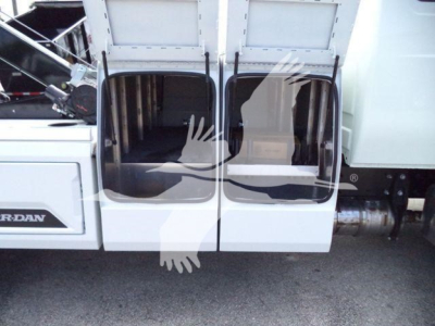 Truck cab entry doors open showing interior from a 2025 International MV stock image. Visible labels: 'Jordan' on driver-side steps plate. No other legible text or numbers visible.