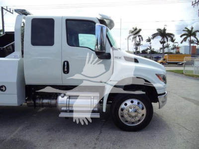 International MV truck side view with winch category, stock number J86683FM, dual cab, white exterior.