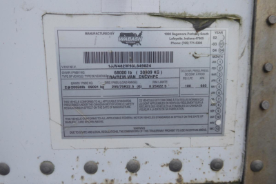 Trailer identification plate showing manufacturer Wabash, VIN 1JJV482W93L849824 with weight and compliance data.