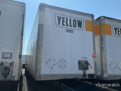 Trailer rear showing YELLOW label and safety decals on a box trailer.