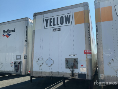 Rear view of a white trailer with a large 'YELLOW' logo and city code, showing ramp door and rear lights.