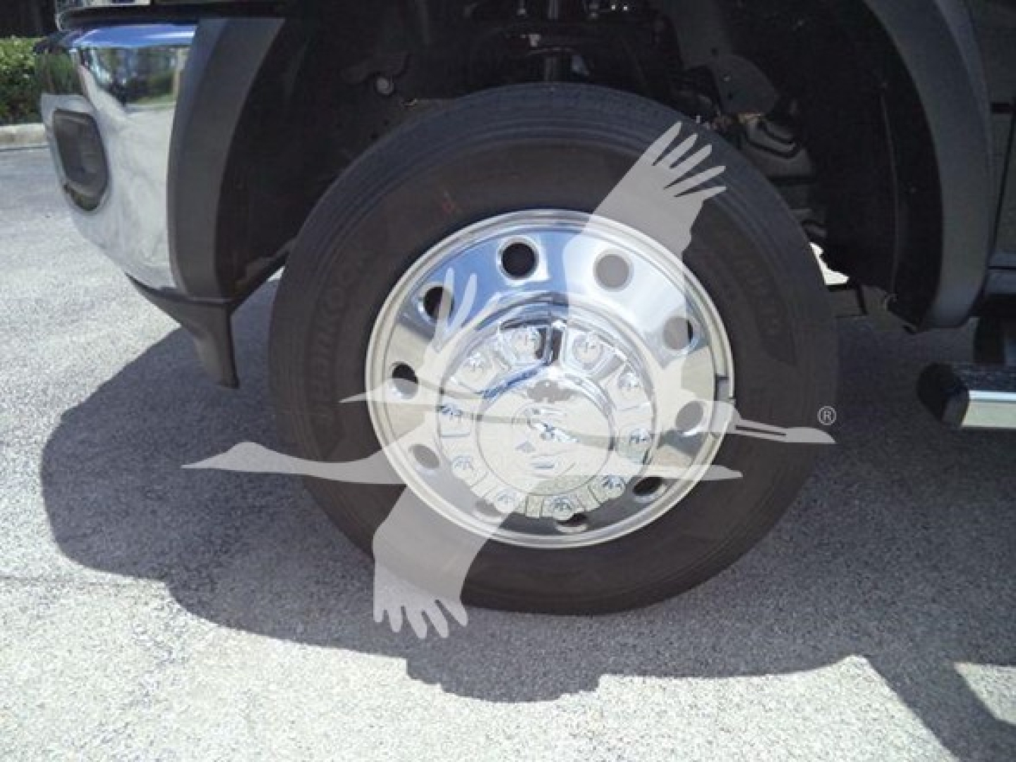 Ram 5500 front wheel and hub showing wheel with chrome cover and stock tire
