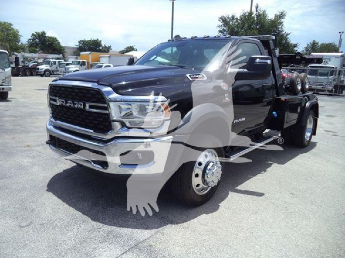 Ram 5500 SRW front-left view showing chrome grille and wheel hub near front, black cab and chassis with winch category listing.