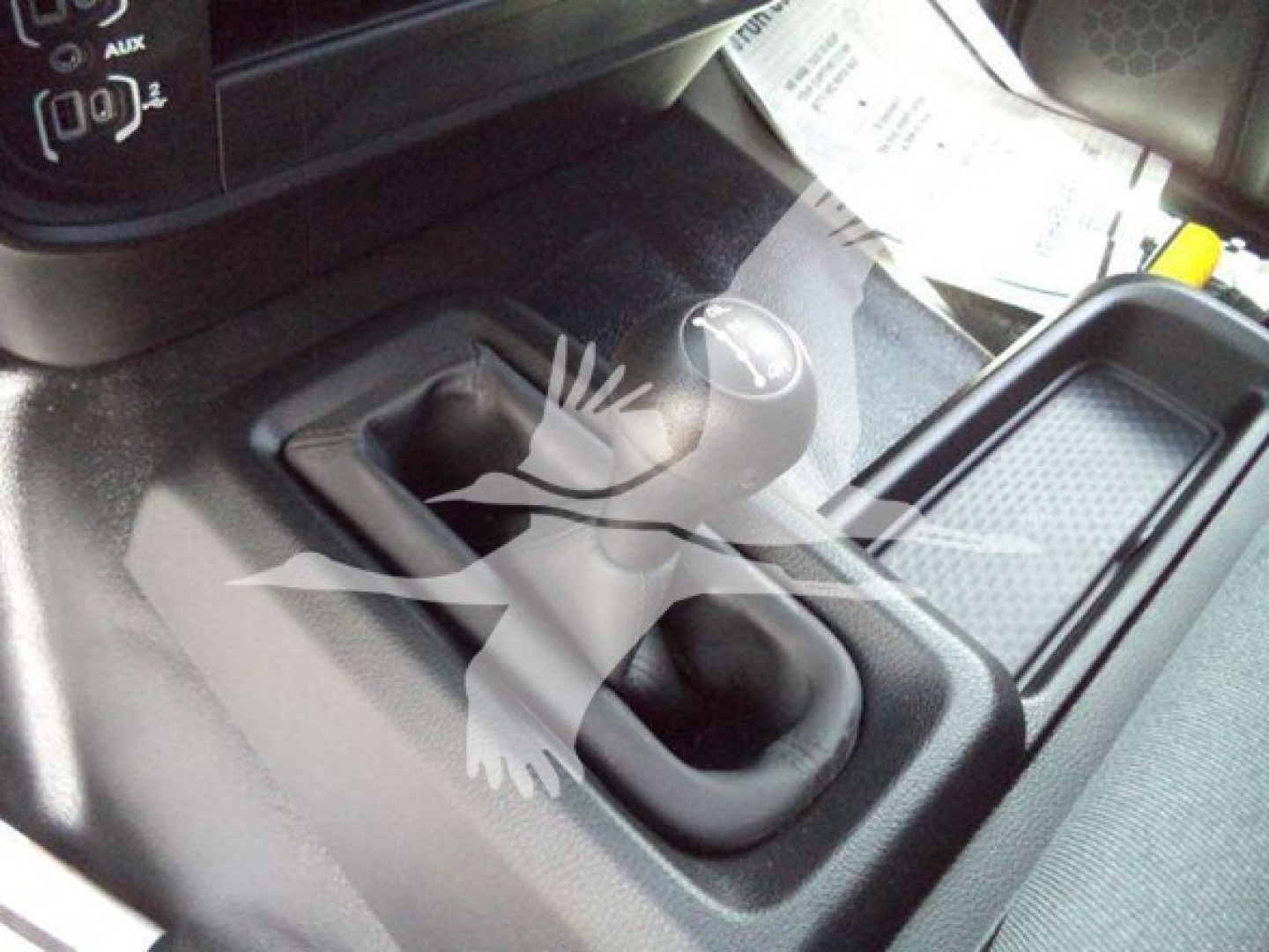 Ram 5500 SLT interior showing shift knob and center console with gear lever and storage area.