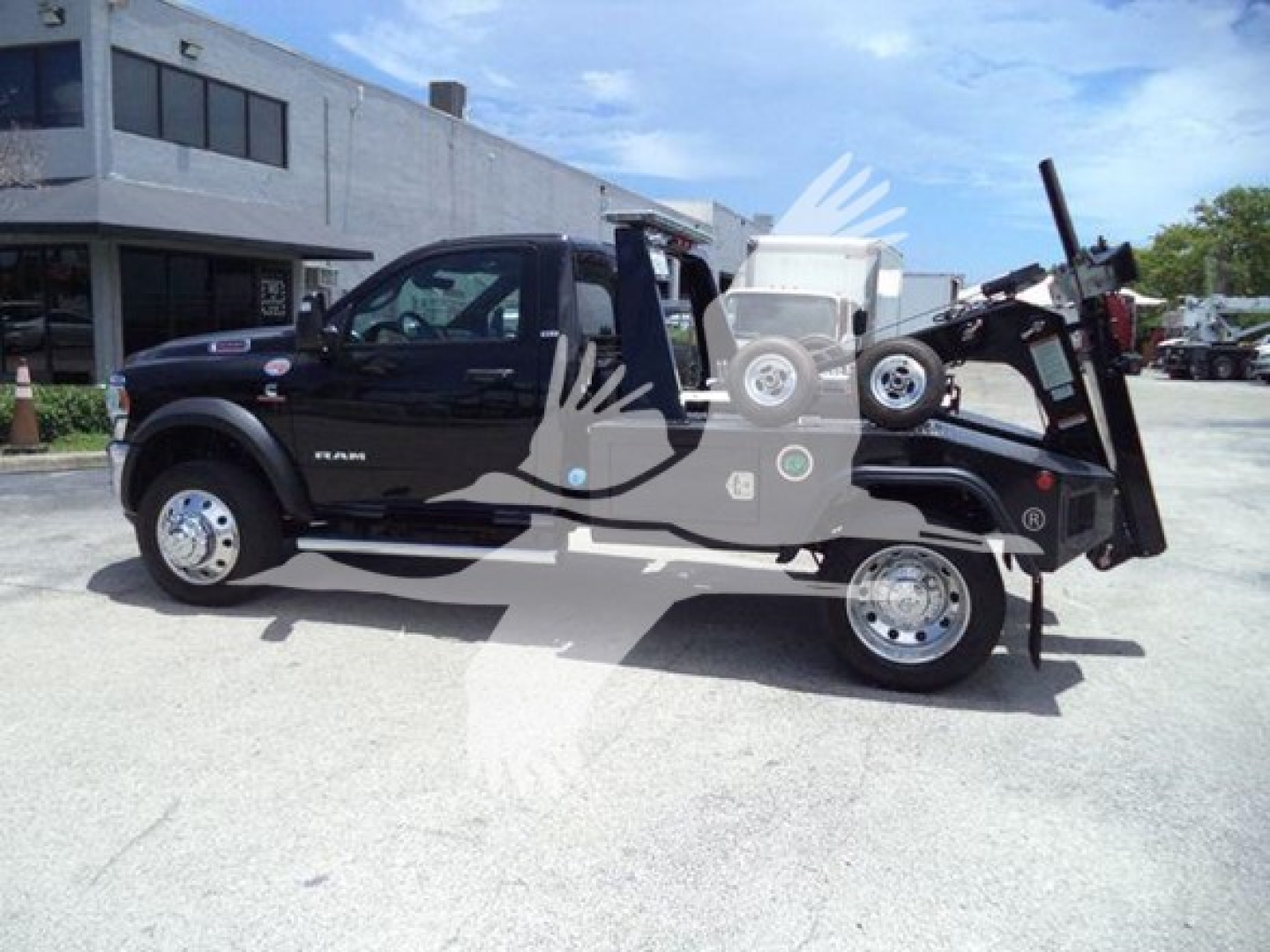 Ram 5500 SLT pickup truck with wrecked bed conversion and winch, side view, black exterior
