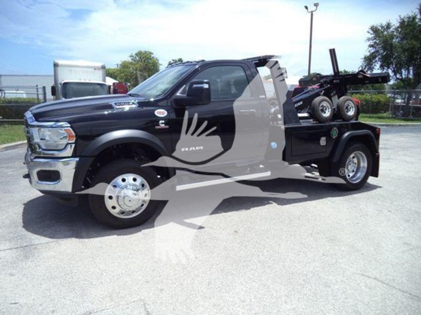 Ram 5500 Slack side view showing winch-equipped bed and dual rear wheel setup with black exterior