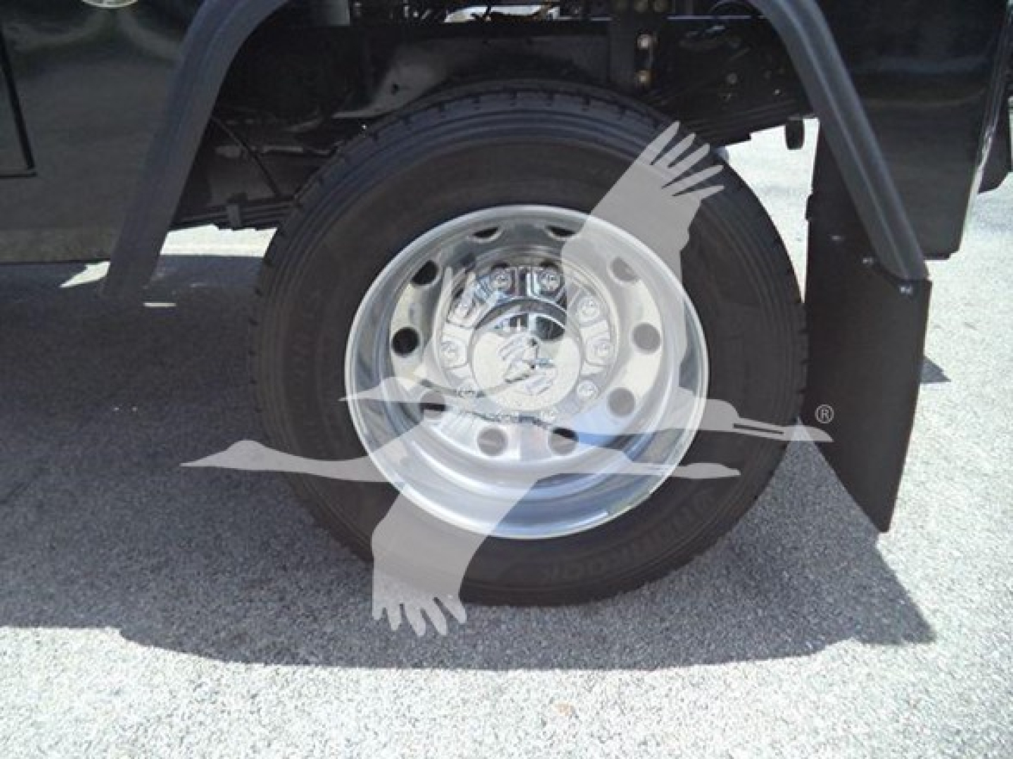 Ram 5500 wheel and tire view with chrome hubcap and fender, showing front wheel area in truck bed.