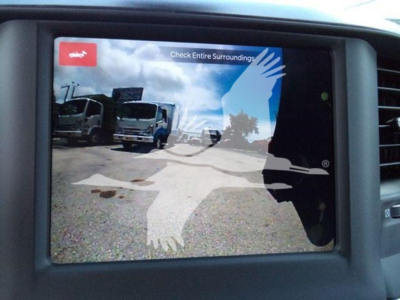 Ram 5500 dash display showing backup camera feed with a silhouette graphic overlay.