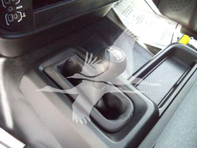 Ram 5500 SLT interior showing shift knob and center console with gear lever and storage area.