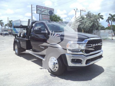 Ram 5500 tow truck towing winch equipment on truck bed with chrome bumper and black body, VIN 3C7WRNDL3RG240088