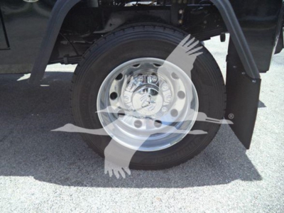 Ram 5500 wheel and tire view with chrome hubcap and fender, showing front wheel area in truck bed.