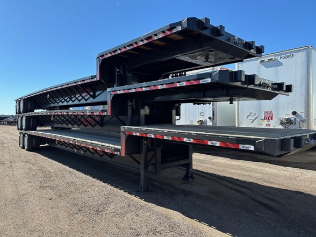 Trailer stack showing multiple closed tandem drop deck sections in a laydown position for 2026 Dura Haul trailer.