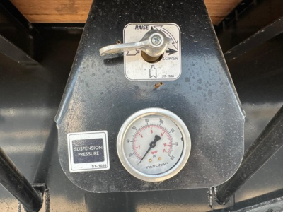 Trailer control panel showing gauge and lever labels on a Dura Haul drop deck trailer