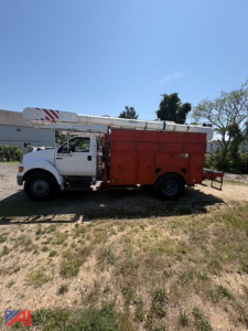 Bucket truck with white cab and red utility body, extended boom mounted on top, side view showing equipment truck.