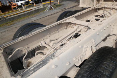  Peterbilt 357 chassis and dual rear axle frame showing white paint and suspension components.